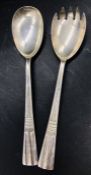 A pair of hallmarked salad servers, in an Art Deco style, makers mark CW, Sheffield 1967