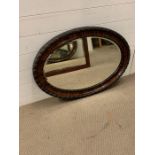 Oval mahogany wall mirror. H87cm