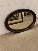 Oval mahogany wall mirror. H87cm