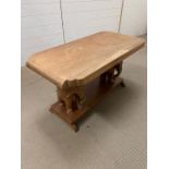 Wooden coffee table with carved elephants to each end. L93cm H50cm W45cm