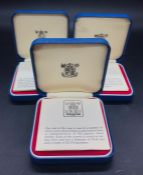 Three cased silver crowns, commemorating Queen Elizabeth II's Silver Jubilee