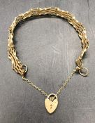 A 9 ct gold gate bracelet with heart fastener (6.6g)