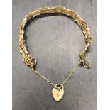 A 9 ct gold gate bracelet with heart fastener (6.6g)