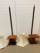 Pair of wooden hand carved floor standing lamps with elephant seat or table. H158cm W38cm