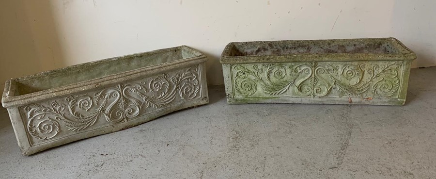 A pair of long garden planters with floral pattern to sides (84cm x 25cm)