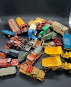 A selection of Diecast trucks and work vehicles to include, Dinky, Matchbox, etc