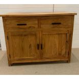A hardwood sideboard with two drawers and cupboard under (H90cm W115cm D48cm)