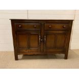A Ercol sideboard, old colonial 1960's (H85cm W123cm D45cm)
