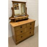 A Two over two drawer dressing chest with mirror and two additional small drawers. H 163 cm x W