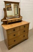 A Two over two drawer dressing chest with mirror and two additional small drawers. H 163 cm x W