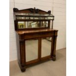 A Victorian mahogany chiffonier with a unique glazed display shelf with hinged lid and two