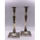 A Pair of Continental silver candlesticks.