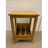 A small side table with magazine racking under (H57cm W40cm D34cm)