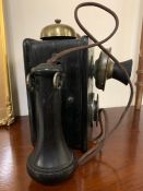 A Wall Mounted Vintage Bell and Handset phone