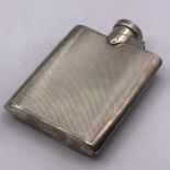 A Machine tooled silver hip flask, hallmarked for Birmingham.