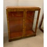A two door glass display cabinet with two shelves (H100cm W89cm D28cm)