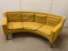 A mid century curved almost 90 degree sofa on oak legs (H70cm W206cm D72cm Seat H34cm)