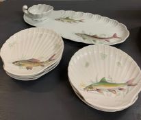 Porcelain de Sologne Limoges eight place fish set to include plates, serving platter and jug.