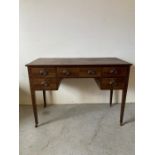 A dressing table on castors (H86cm W114cm D55cm)