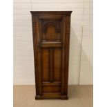 A oak hall cupboard by Lock of London (H180cm W73cm D50cm)