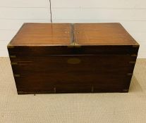 A campaign chest with brass banding and handles with a spilt two door lids (H48cm W96cm D48cm)