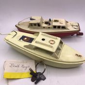 Two vintage metal boats with keys