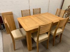 A solid oak dining table with six chairs and extending leaf (140cm x 90cm) (extended 180cm)