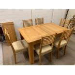 A solid oak dining table with six chairs and extending leaf (140cm x 90cm) (extended 180cm)