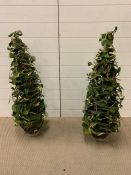 A pair of decorative artificial trees