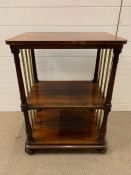 A mahogany two tiered table with brass supports to sides (H82cm W61cm D45cm)