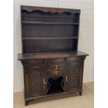 A oak dresser with plate rack (H183cm W138cm D48cm)