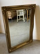 A gilt mantle/wall mirror (W92cm x H64cm)