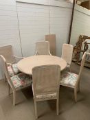 A conservatory round dining room table and four matching chairs and two carvers (H46cm Diam 127cm)