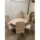 A conservatory round dining room table and four matching chairs and two carvers (H46cm Diam 127cm)