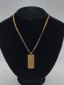 A 9ct yellow gold November pendant on a 9ct gold chain.(12g)