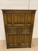 An oak cocktail cabinet