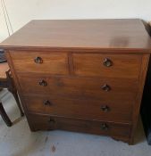 An oak two over three chest of drawers