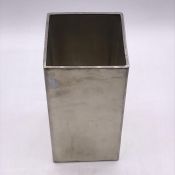 A White metal brush pot or vase.