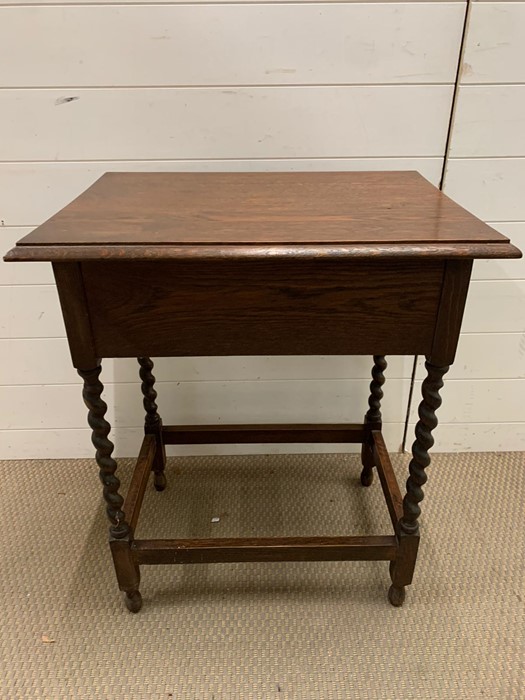 A mahogany side table with barley twist legs and drawer to one end (H73cm W60cm D46cm)