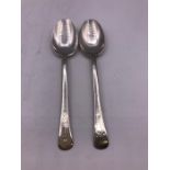 Two silver teaspoons.