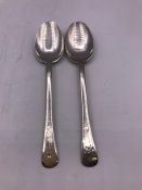 Two silver teaspoons.