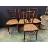 Four cane seat dining chairs with spindle back