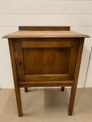 An Oak pot cupboard with Tudor Rose design H 83cm x W 60cm x D 46cm.