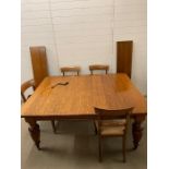 A Victorian mahogany extendable dining table with two additional leaves, on turned legs with four