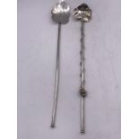 Two Mexican silver stirrers.
