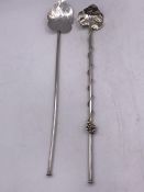 Two Mexican silver stirrers.