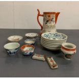 A selection of oriental tea bowls, plates and jug