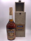 A Bottle of Black Bush, Bushmills whisky and a bottle of Martell Cognac.