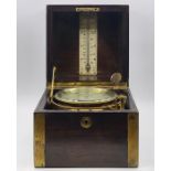 A brass bound mahogany marine chronometer, with lacquered brass gimbal mount and silvered Roman dial