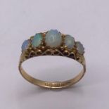 A 9ct Five stone Opal ring. Size R